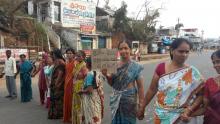 protesting on being denied rice  for not having ration cards after cyclone