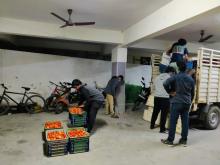 IT Employees unloading the Tomato load